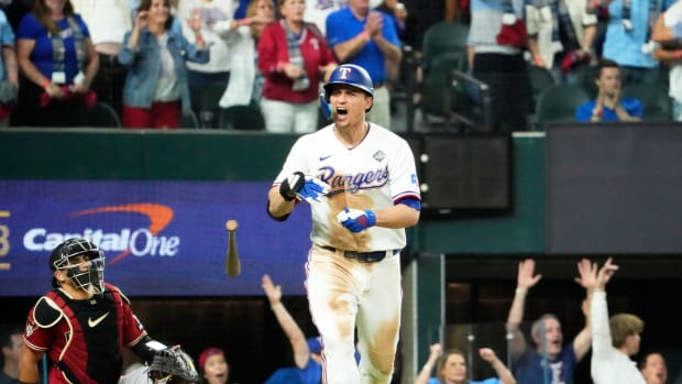 Texas Rangers Corey Seager reacts after connecting for a game-tying, two-run home run off Arizona Diamondbacks relief pitcher Paul Sewald in the ninth inning during Game 1 of the World Series at Globe Life Field.